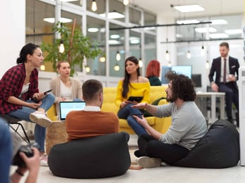 Engaged and productive employees in the office having a meeting.