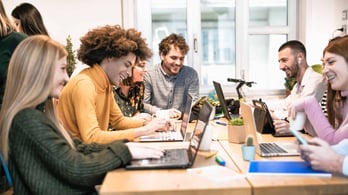 Employees planning team celebration gift ideas.