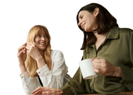 Two women looking at the Giftbit Blog.