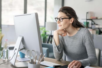 payout administrator using her computer