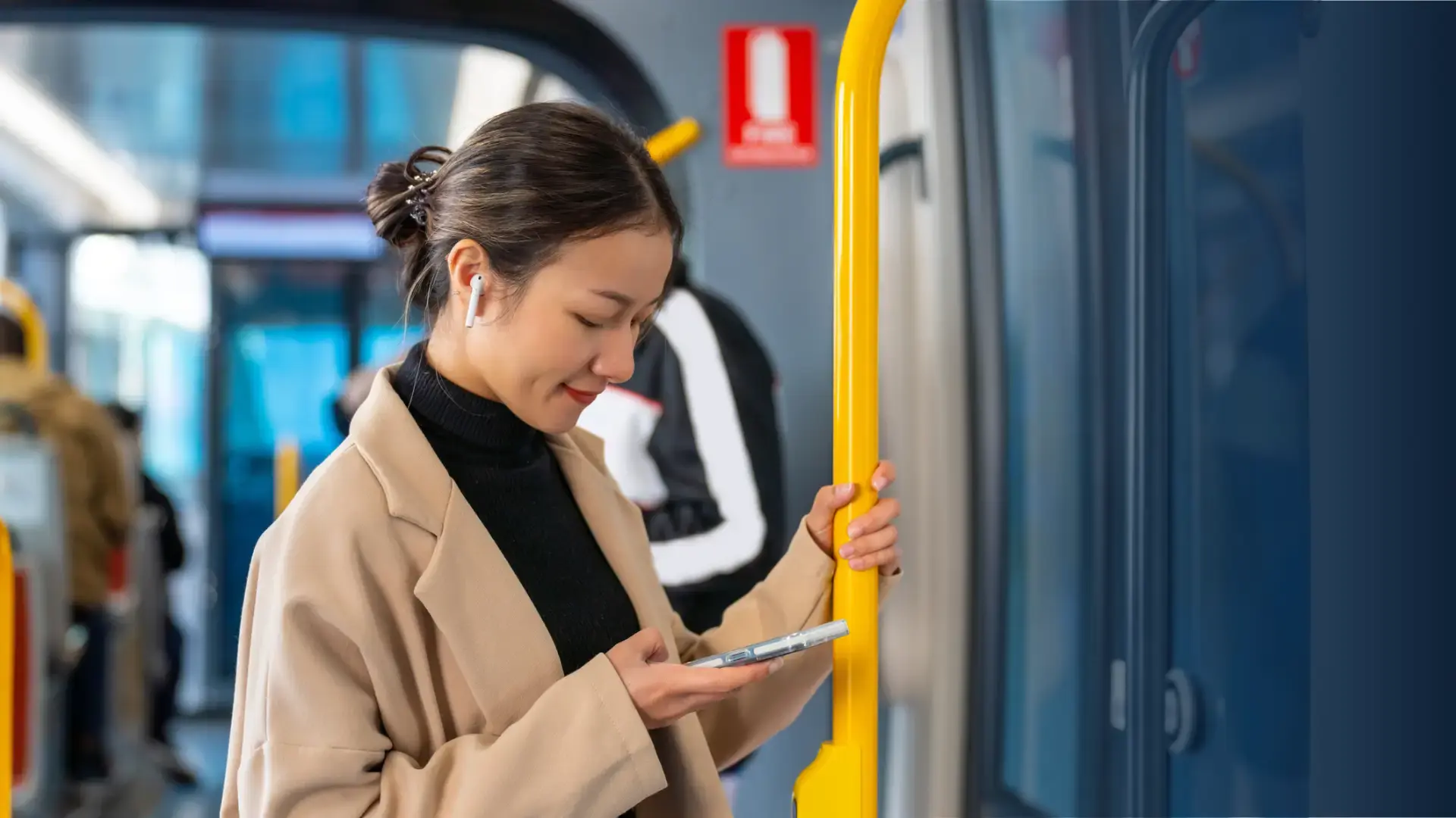 young business woman using phone on an international train